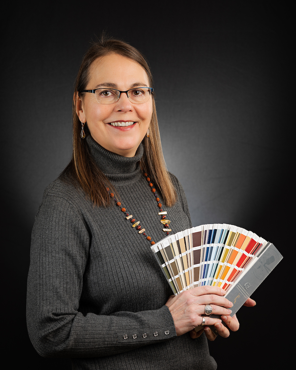 Becky Gordon holding paint color fan decks